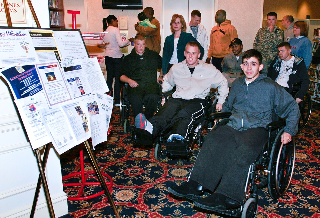 Injured troops line up for barbeque during the Virginia Ann Wiedmaier Holiday Dinner, Dec. 3, 2007. Local restaurants brought dinner for the troops and their families.