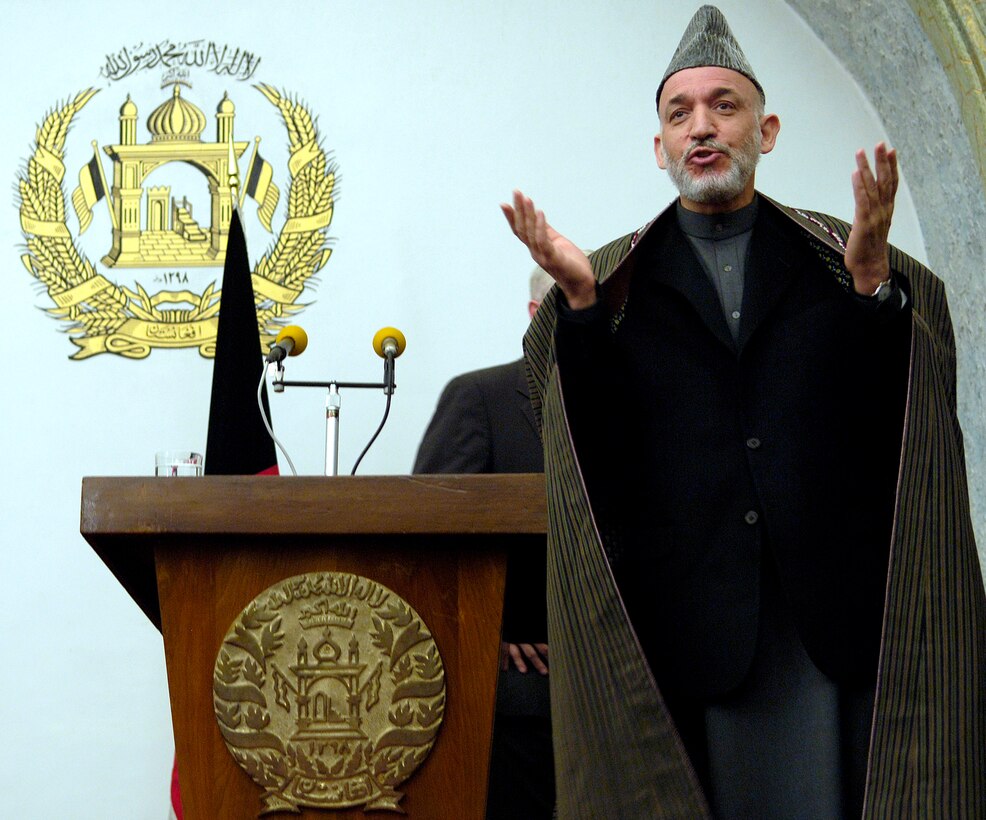 Afghan President Hamid Karzai answers a question at the end of a joint press conference with Defense Secretary Robert M. Gates at the presidential palace in Kabul, Afghanistan, Dec. 4, 2007.  