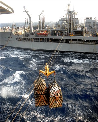 Cargo nets filled with supplies and mail are transported over cables ...