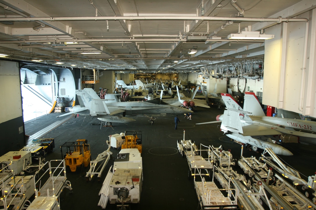 071204-M-0007C-2531.jpg MARINE CORPS AIR STATION MIRAMAR, Calif. - Inside the hangar deck of the USS Nimitz, Marine Fighter Attack Squadron 232's, Marine Aircraft Group 11, 3rd Marine Aircraft Wing maintenance Marines take care of most of the F/A-18A Hornets the squadron flies. Maintenance workers rotate in 12-hour shifts, ensuring the squadron's aircraft remain ready to fly.  (U.S. Marine Corps photo by Lance Cpl. Fredrick J. Coleman) (Released)