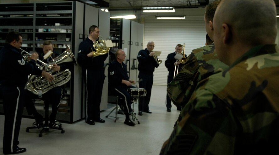 KUNSAN AIR BASE, South Korea -- The Air Force Band of the Pacific perform a Christmas carol for 8th Medical Group Airmen during the band's holiday tour here Dec. 3. The Elmendorf Air Force Base, Alaska based band is here for a week spreading holiday cheer across the base and in the local Gunsan City area. (U.S. Air Force Photo/Master Sgt. Sean P. Houlihan)                                             