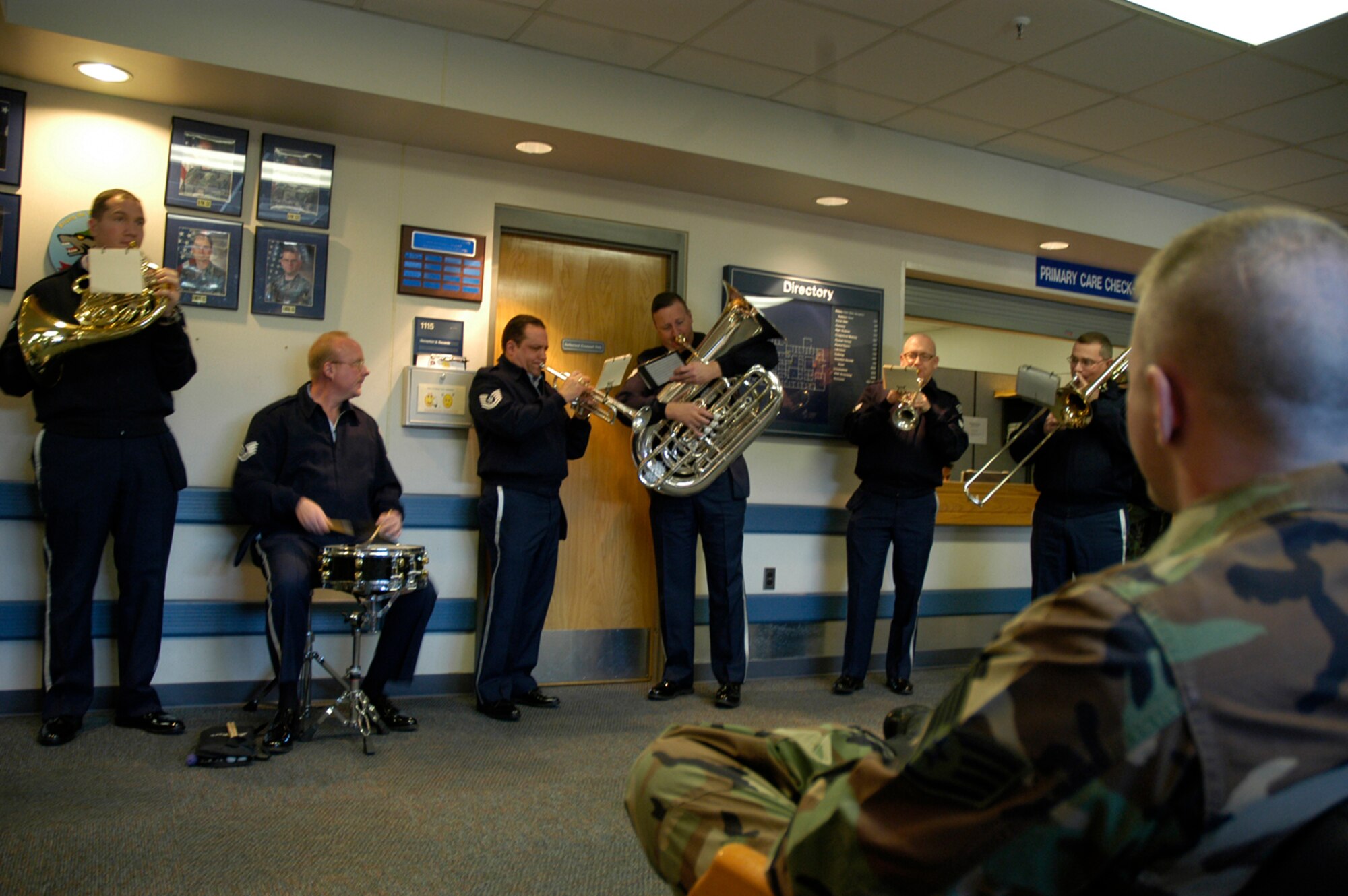 KUNSAN AIR BASE, South Korea -- The Air Force Band of the Pacific perform a Christmas carol for patients at the 8th Medical Group during the band's holiday tour here Dec. 3. The Elmendorf Air Force Base, Alaska based band is here for a week spreading holiday cheer across the base and in the local Gunsan City area. (U.S. Air Force Photo/Master Sgt. Sean P. Houlihan)                