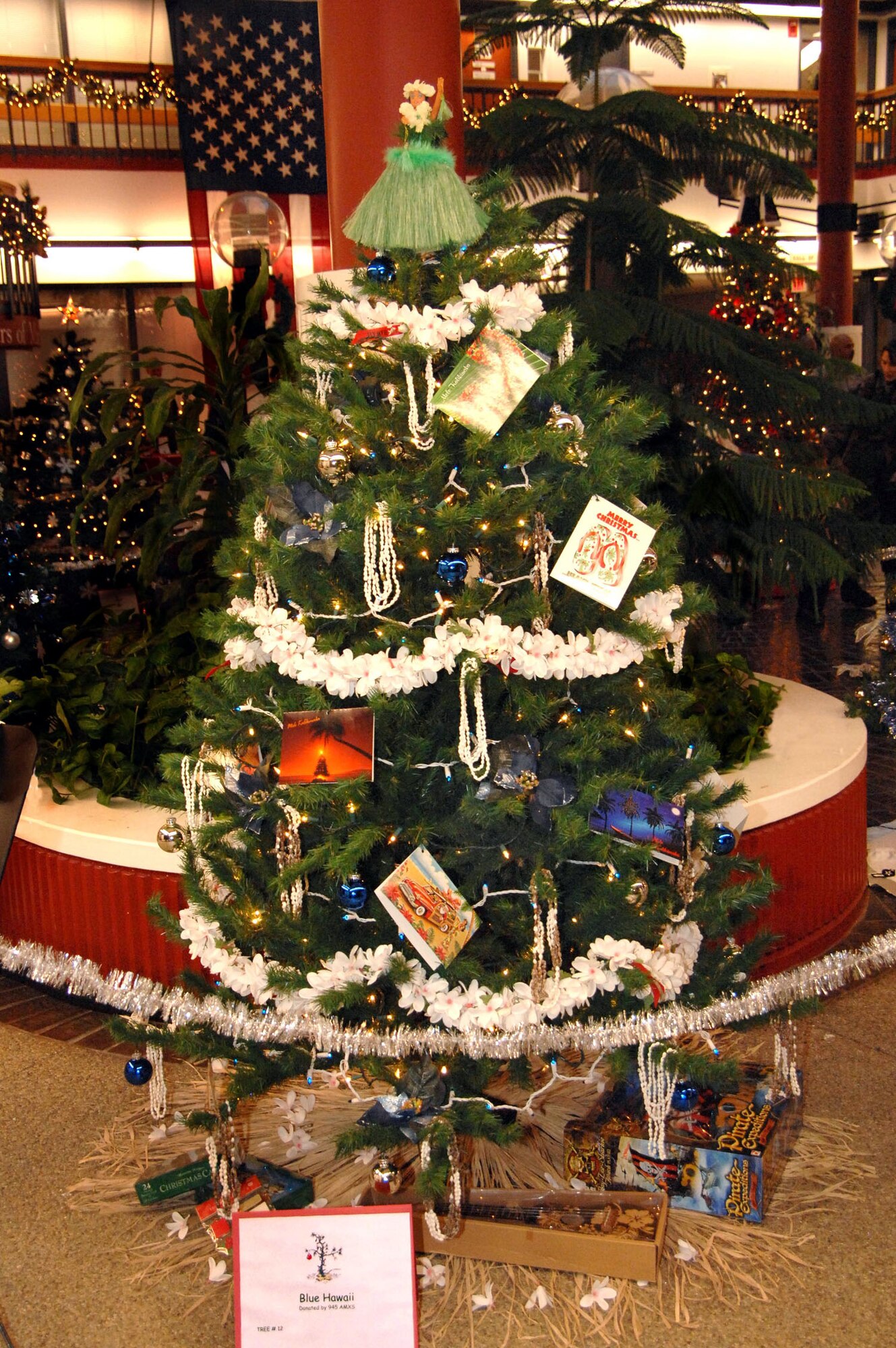 945th Aerial Port Squadron's tree "Blue Hawaii" sells for $300 at the Sixth Annual Travis Fisher House Holiday Tree Festival and Auction, Nov. 29. (U.S. Air Force photo/Ms. Nan Wylie)