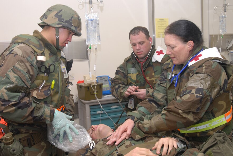 Members of the 18th Medical Support Squadron and 18th Medical Operations Squadron, perform Cardiopulmonary resuscitation on a victim with smoke inhalation as part of an attack scenario at Bldg. 46810 during Local Operational Readiness Exercise Beverly High 08-2 at Kadena Air Base, Japan, Dec. 5, 2007. These scenarios enable base agencies to work together, mitigate real-world situations, and heighten readiness capabilities.
(U.S. Air Force photo/Staff Sgt. Chrissy FitzGerald)