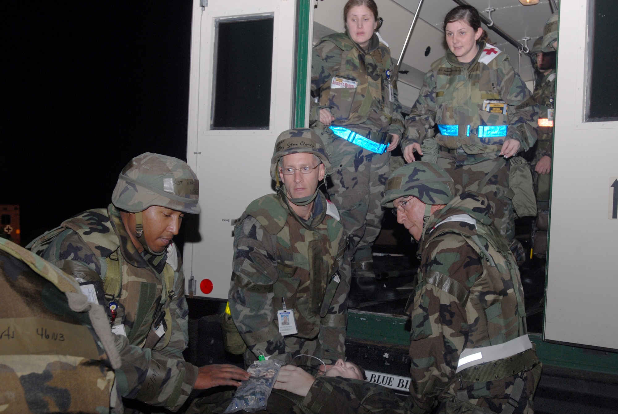 Members of the 18th Medical Support Squadron and 18th Medical Operations Squadron, load a victim of severe smoke inhalation into an ambulance to be treated at Lester Naval Hospital, on Camp Lester, Japan, as part of an attack scenario at Bldg. 46810 during Local Operational Readiness Exercise Beverly High 08-2 at Kadena Air Base, Japan, Dec. 5, 2007. These scenarios enable base agencies to work together, mitigate real-world situations, and heighten readiness capabilities.
(U.S. Air Force photo/Staff Sgt. Chrissy FitzGerald)