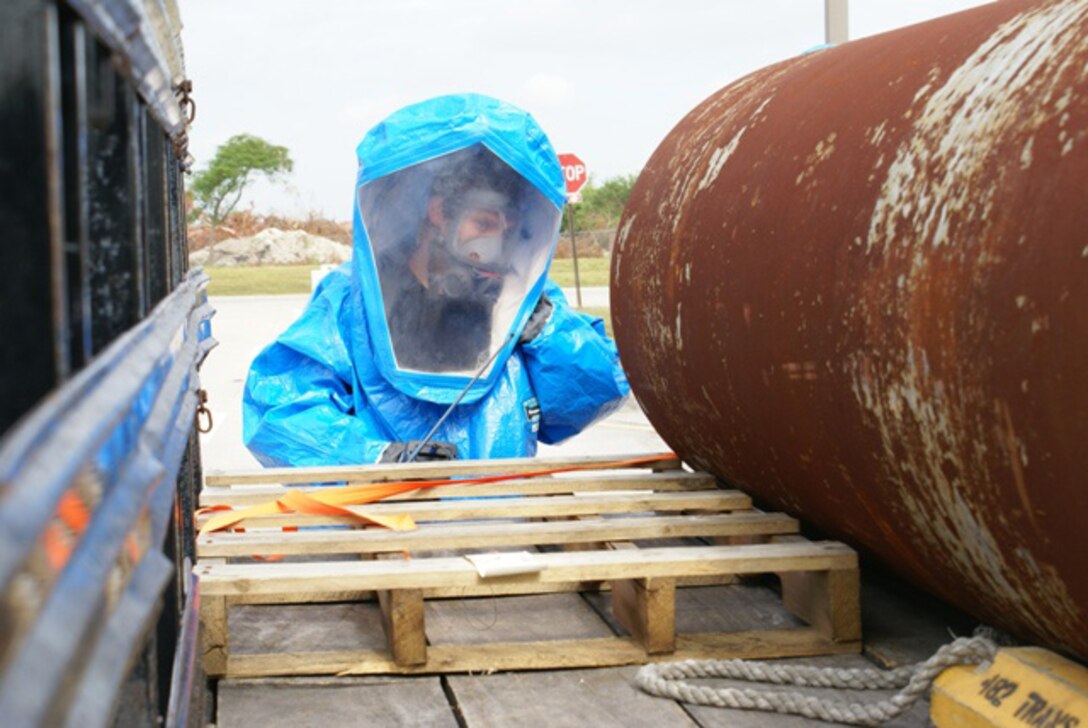 Jeffery Curl, 482nd Civil Engineer Squadron Fire and Emergency Services technician, responds to a simulated hazardous gas leak at the front gate during a force protection exercise Dec. 5. The base-wide exercise, facilitated by the 482nd Mission Support Group Emergency Management Office, gave the scenario involving a terrorist detonating a chlorine bomb at the front gate. The command and control of base emergency response forces were tested, and the exercise aimed to improve contingency response measures. (Photo by Senior Airman Erik Hofmeyer)