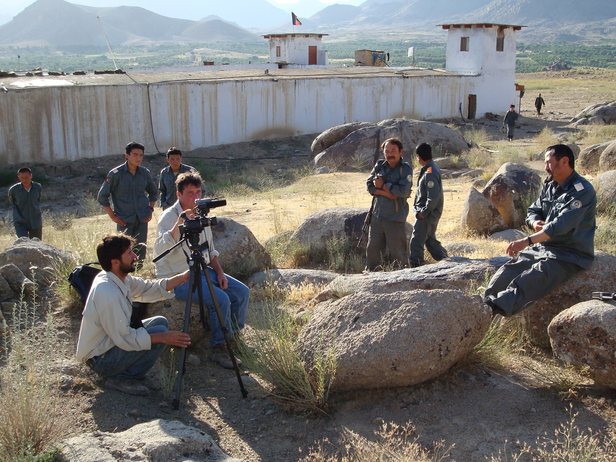 Members of the Afghan National Police here prepare for an interview with Voice of America reporters in July 2007.  A new reform effort is underway by the Combined Transition Command Afghanistan in Kabul to make the national police force more effective and less corrupt.  A five- to seven-year program known as Focused District Development, or FDD, is designed to transform the ANP into an independent, well-trained, ethnically-balanced, respectable and sustainable Afghan national security force.  (Air Force photo by Capt. Bob Everdeen)

