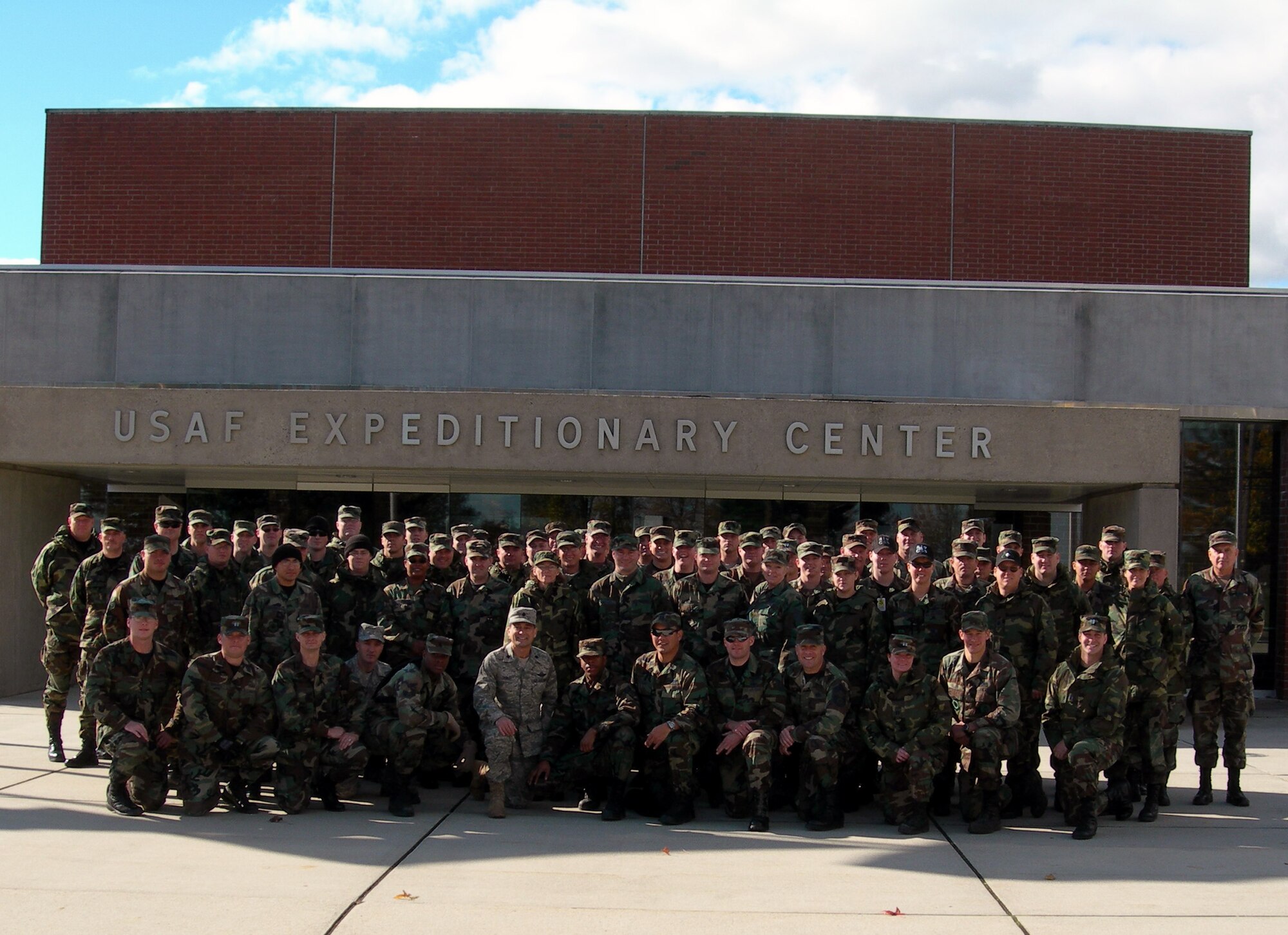Fifty-six Airmen from the 123rd Contingency Response Group, Kentucky Air National Guard at Louisville, stop for a photo in from of the U.S. Air Force Expeditionary Center Nov. 16, 2007 -- the last day of their training in the Contingency Response Formal Training Unit Basic Course 08-1.  The course, taught by the Center's Mobility Operations School with support from the Expeditionary Operations School, lasted 22 days.  The 123rd CRG is the U.S.' and Air Force's first Air National Guard CRG unit.  (U.S. Air Force Photo/Master Sgt. David Oliver)   
