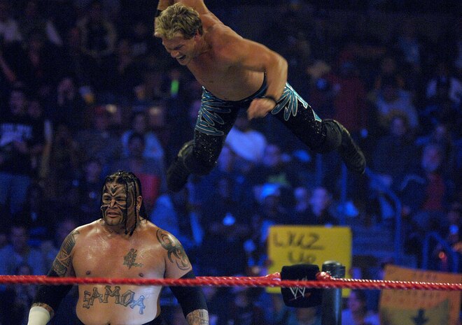 Chris Jericho, jumps from the top rope, and flies into WWE performer ?Umaga? during their performance at the North Charleston Coliseum Monday. The World Wrestling Entertainment, Inc., in their ongoing effort of paying homage to active-duty servicemembers, donated the remaining unsold open seats to military members the night of their performance. (U.S. Air Force photo/Senior Airman Nicholas Pilch)