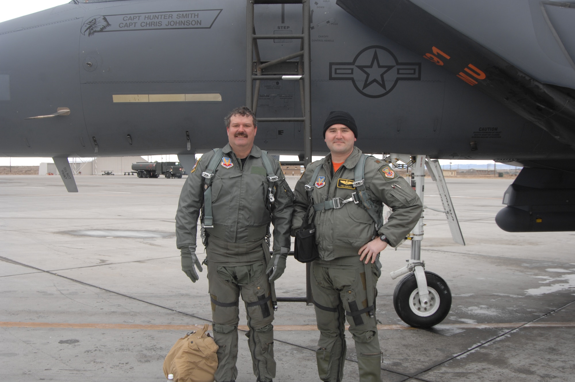 MOUNTAIN HOME AIR FORCE BASE, Idaho -- Ray Liercke from Liercke Construction stands next to an F-15E along with Maj. Thomas "Tomcat" Hancock, F-15E pilot, here Nov. 30. Liercke received an incentive flight along with two other lucky Honorary Commanders. (U.S. Air Force photo/ Airman 1st Class Dana Hill)