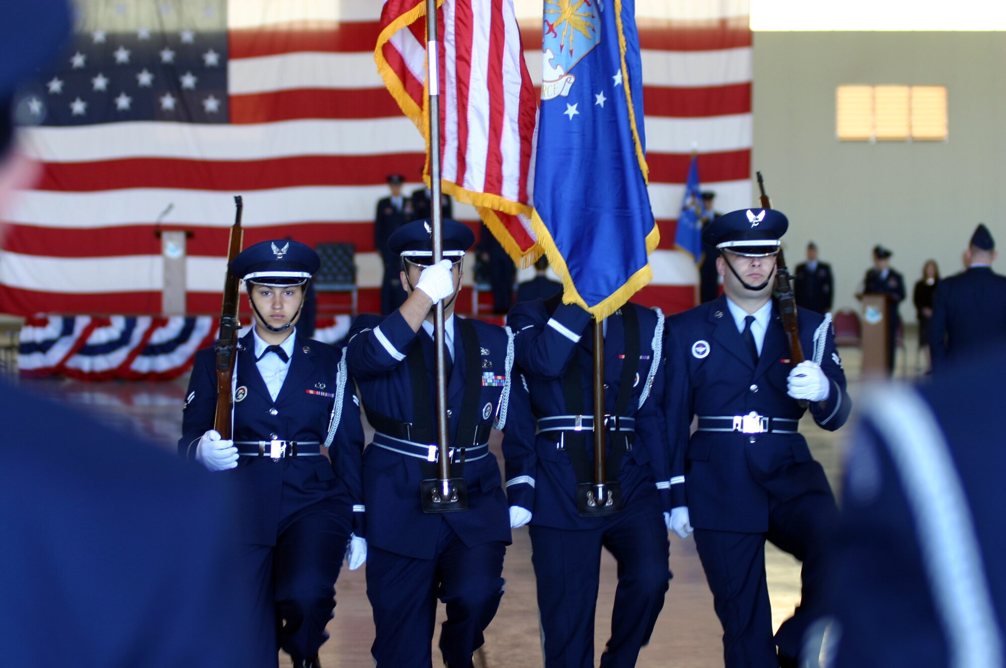 Members of the base honor guard team march in unison after the presentation of the colors during the 47th Flying Training Wing change of-command ceremony Tuesday.  During the ceremony, Col. John Doucette assumed command of the wing from Col. Mike Minahan. (U.S. Air Force photo/ Senior Airman Olufemi Owolabi)