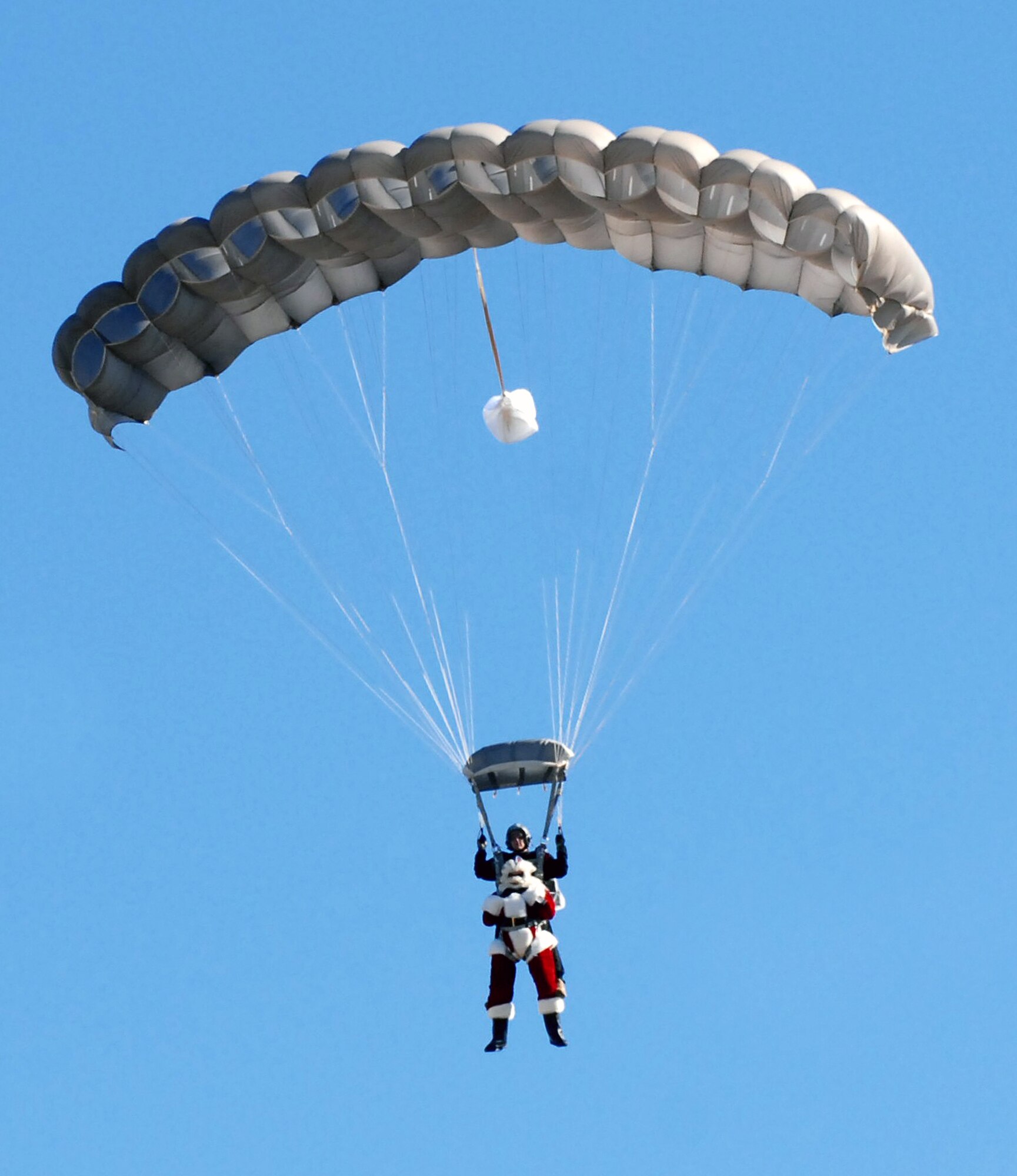 Santa skydives onto the 37th Training Wing parade field at Lackland Air Force Base, Texas, on Dec. 4 to help TxDOT kick off their annual four-week drunken driving prevention campaign. This is the 10th year of the Texas Department of Transportation's holiday public education campaign.  (USAF photo by Alan Boedeker)