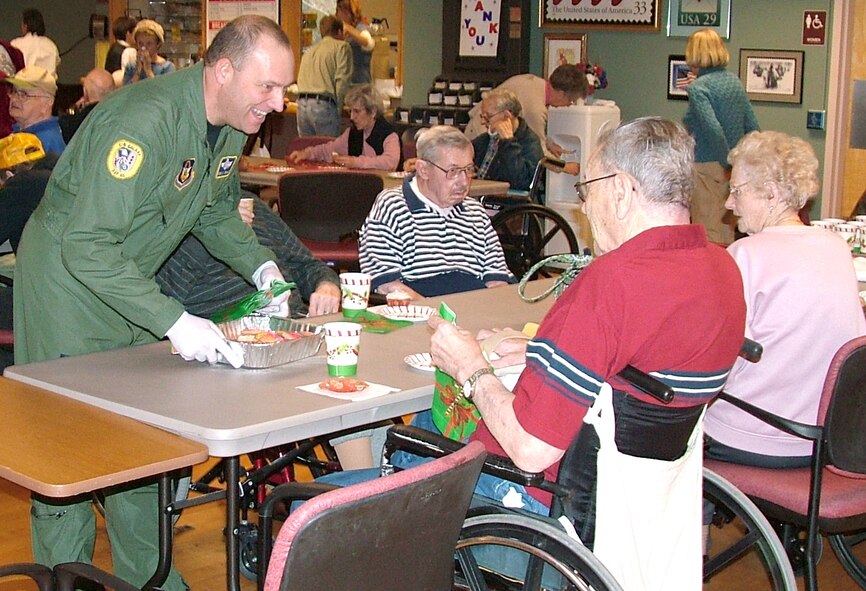 Master Sgt. Christopher Maille, serves veterans at the Soldiers Home in Holyoke, Mass., Nov. 29. Sergeant Maille was among more than 80 members of the 439th Airlift Wing who visited the Soldiers Home as part of serving food and dropping off donated items.