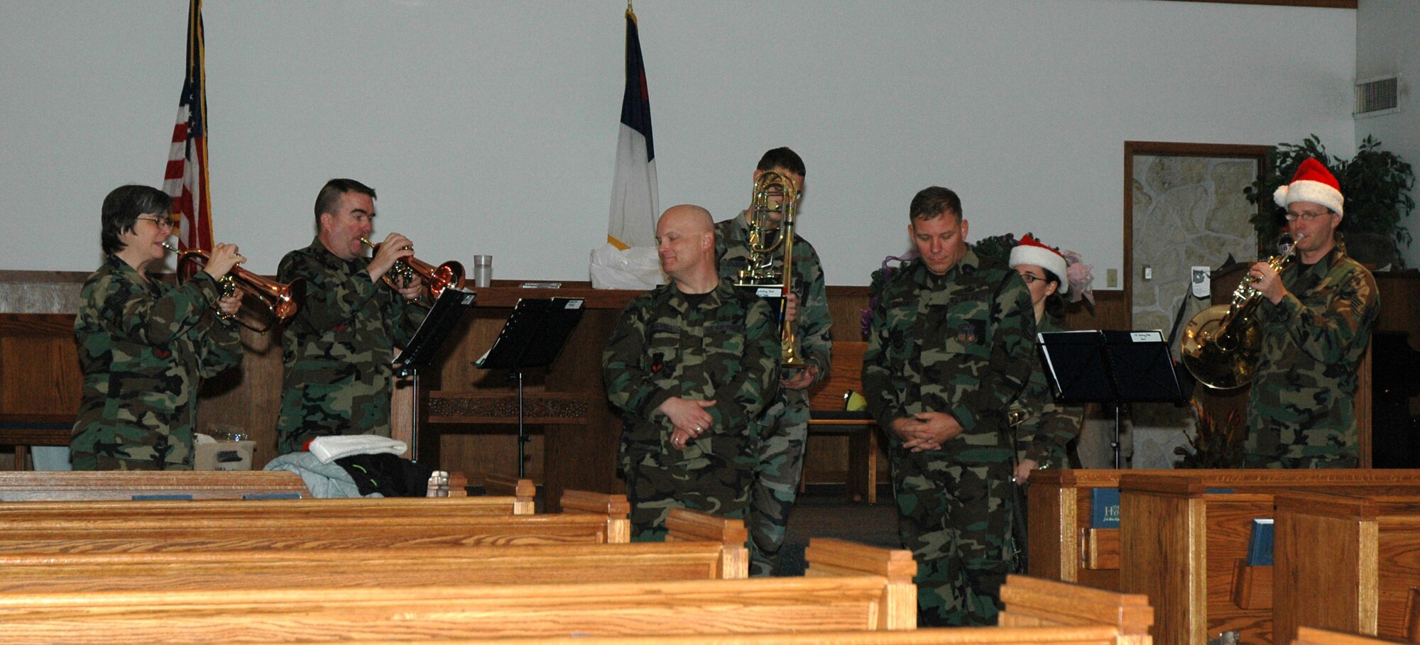The U.S. Air Force Heartland of America Band from Offut Air Force Base, Neb., and Chief Master Sgt. Steve Sargent, 341st Space Wing command chief, perform "Holy Night" in the chapel sanctuary Nov. 29. The band performed at Malmstrom Nov. 28 to 29 to spread holiday cheer. (U.S. Air Force photo/Airman 1st Class Dillon White) 