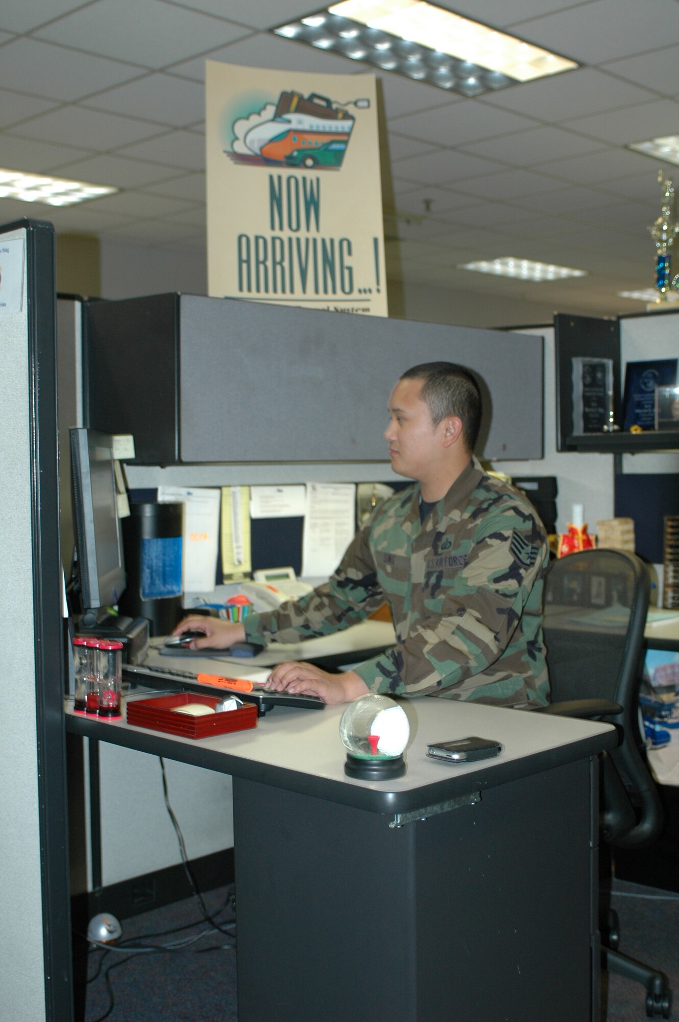 Staff Sgt. Marvin Sing works on processing a travel voucher. The customer support section processes 140 to 200 vouchers per day. (U.S Air Force photo/Nick DeCicco)