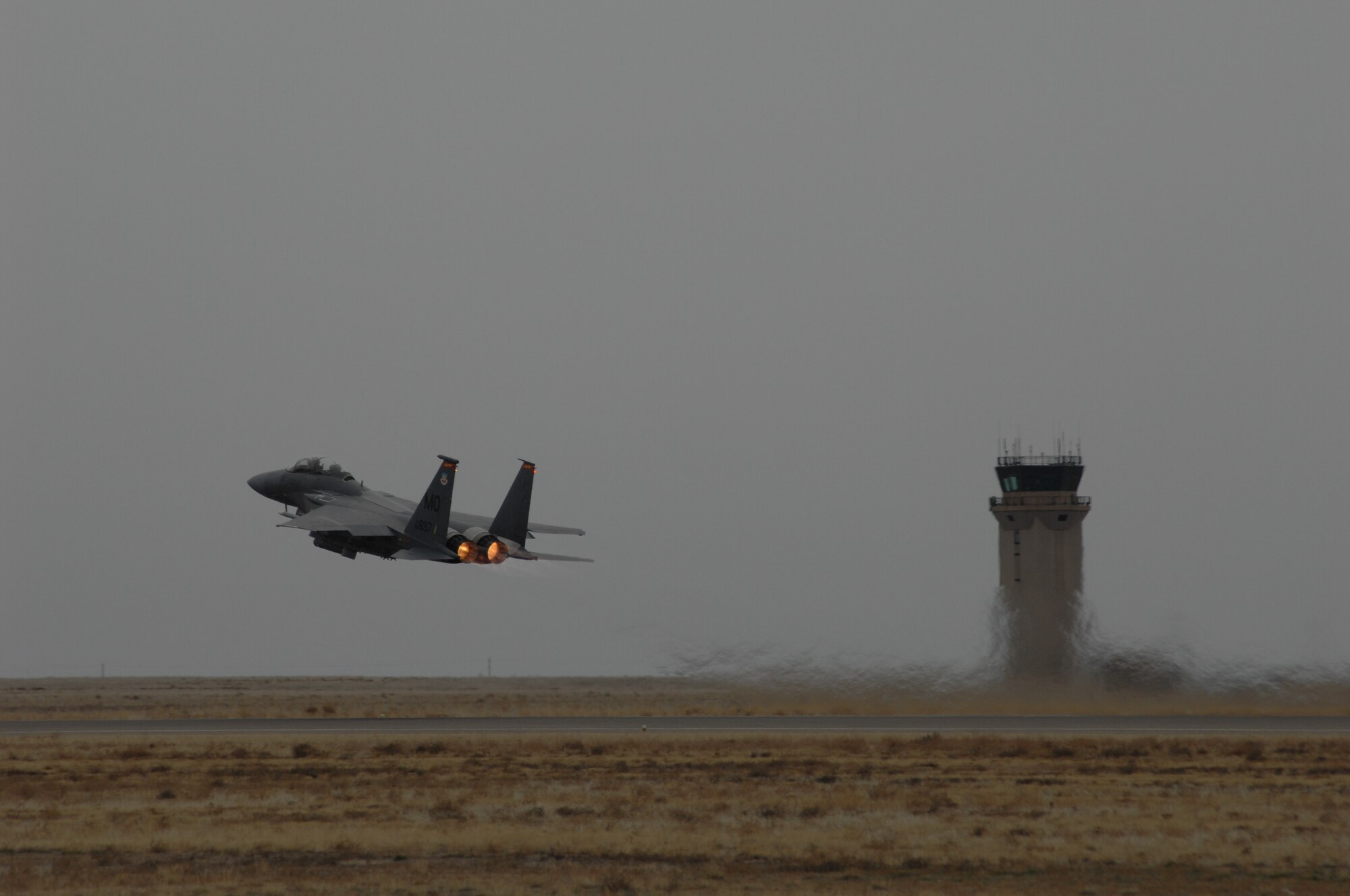 MOUNTAIN HOME AIR FORCE BASE, Idaho -- An F-15E climbs into the sky carrying a former Honorary Commander on an incentive flight here Nov. 30. Four former Honorary Commanders were chosen for this honor in July. (U.S. Air Force photo/ Airman 1st Class Dana Hill)