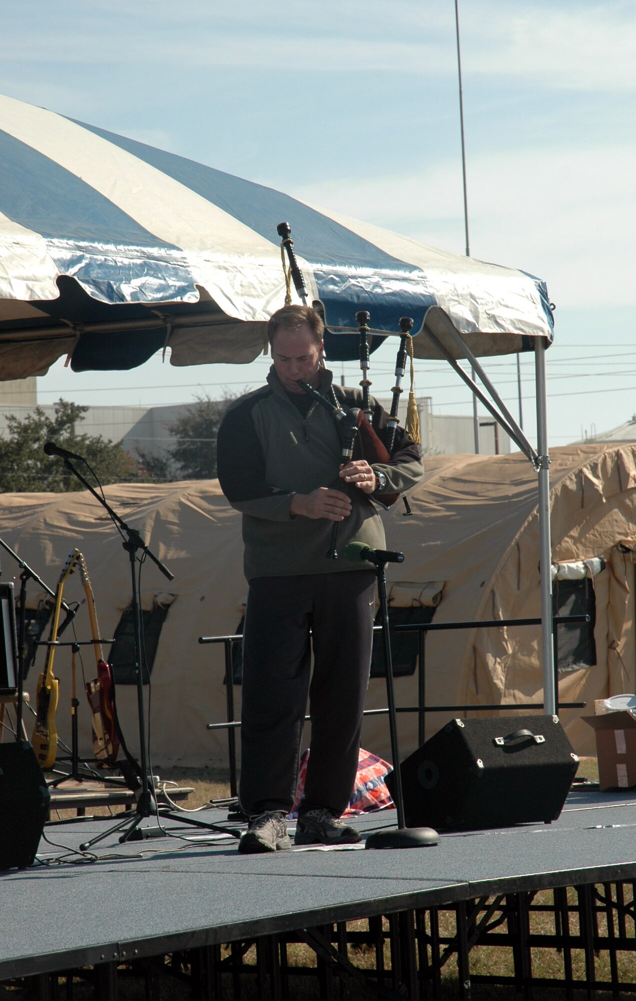 Master Sgt. Steven Bicknell, 919th Maintenance Squadron, plays Christmas tunes on his bag pipes during the 919th Special Operatins Wing Family Day Dec. 1. Other performers included Duke Field's Wing Band and 3 O'clock Station. (U.S. Air Force Photo/Jasmine DeNamur)