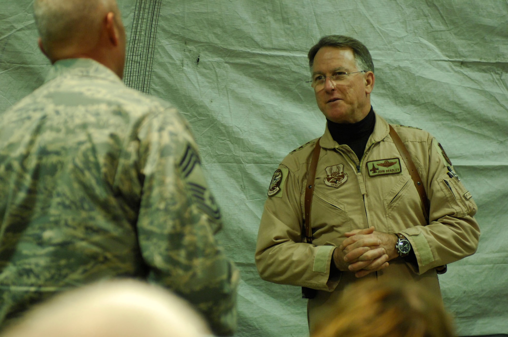 BAGRAM AIR BASE, Afghanistan - Lt. Gen. John Bradley, commander, Air Force Reserve Command, answers a question from Chief Master Sgt. Stanley Burrows, 455th Expeditionary Security Forces Squadron here, Dec. 3, 2007. General Bradley stopped here to visit with deployed Airmen, hear their concerns and thank them for their service. 
(U.S. Air Force Photo by Staff Sgt. Joshua Jasper)
