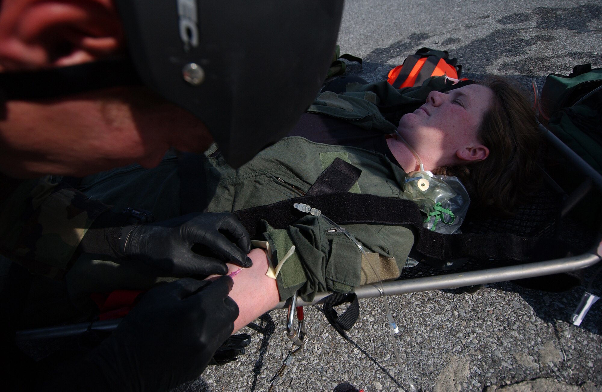 A pararescueman from the 31st Rescue Squadron treats an injured victim as part of a simulated water rescue during Local Operational Readiness Exercise Beverly High 08-02 at Kadena Air Base, Japan, Dec. 5, 2007. These scenarios enable pararescuemen to develop their proficiency in water-based rescues and life-saving skills.
(U.S. Air Force photo/Tech. Sgt. Reynaldo Ramon)

