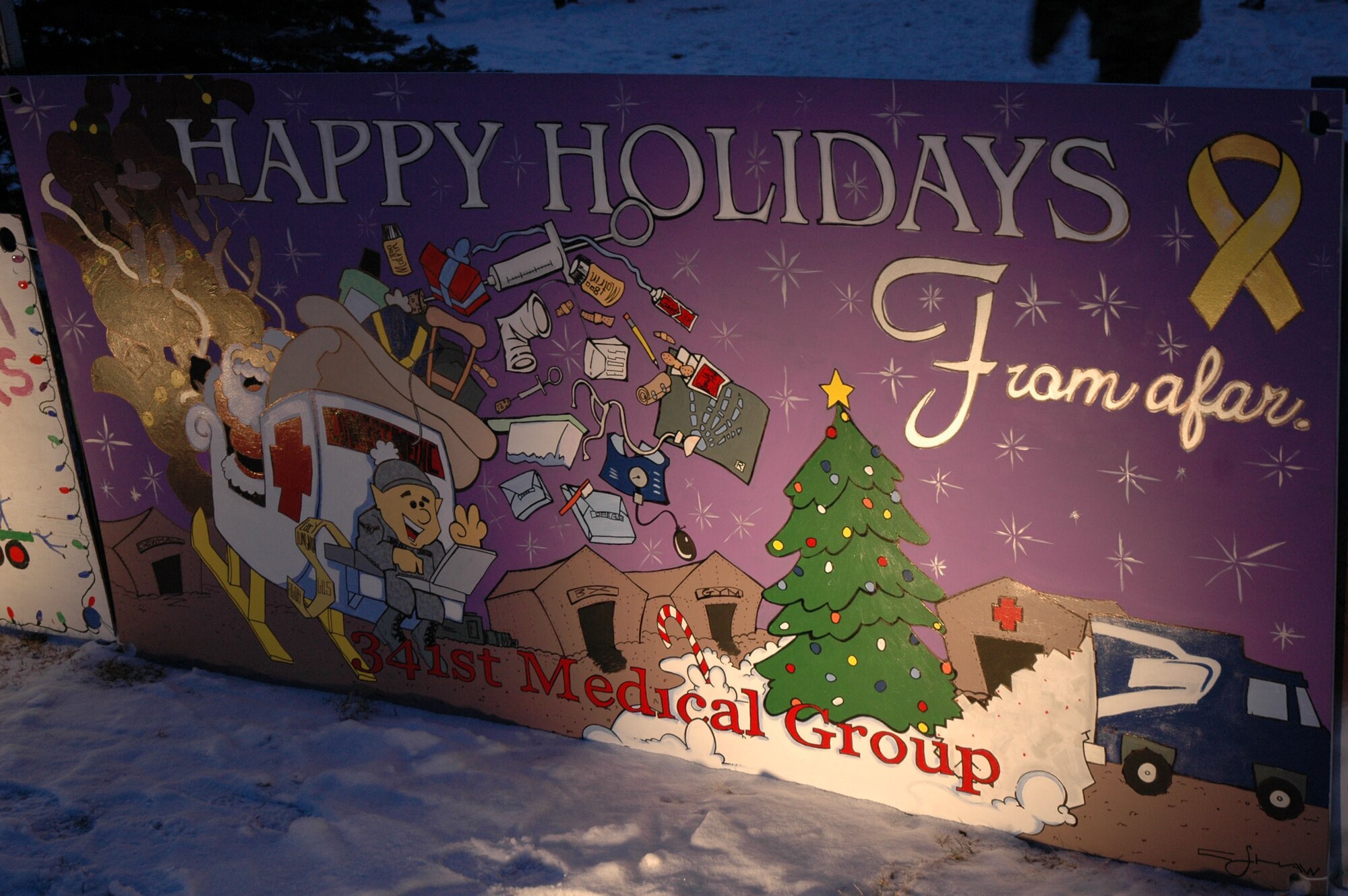 The 341st Medical Operations Group won first prize in the holiday card contest at the Grizzly Bend Club Nov. 29. The 4-foot-by-8-foot cards were made by people from the 341st Space Wing squadrons and organizations. Entries were judged based on theme, originality and artistic appreciation and will remain on display throughout the holiday season. (U.S. Air Force photo/Airman 1st Class Dillon White)