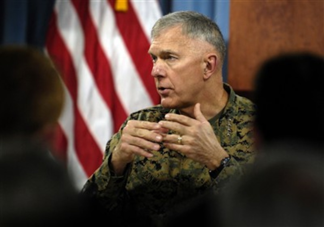 Commandant of the Marine Corps Gen. James T. Conway answers a reporter's question as he conducts a media roundtable in the Pentagon on Dec. 5, 2007.  