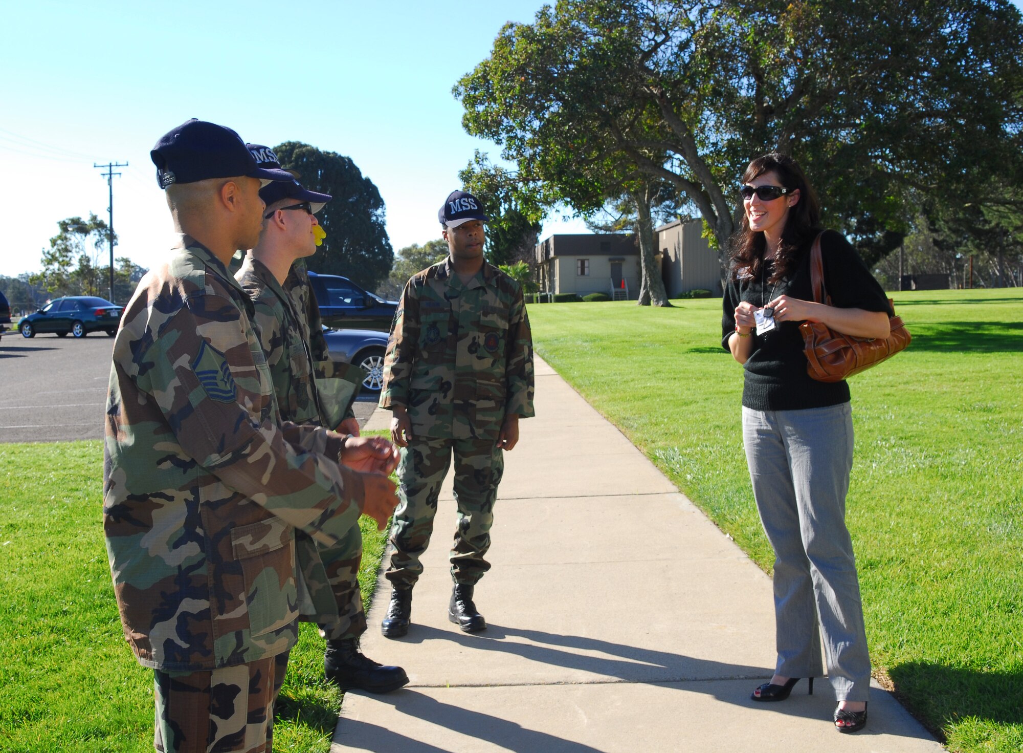 ORCUTT, Calif. -- Marsha Garcia of the 30th Services Division meets with volunteering Airmen before picking up care packages from the Luis Oasis Senior Center to deliver to Vandenberg's deployed Airmen on Dec. 5. The senior center, in conjunction with the services department, decided to give their yearly donation this year to those deployed without immediate families during the holidays.  (U.S. Air Force photo/Airman 1st Class Ashley Tyler)