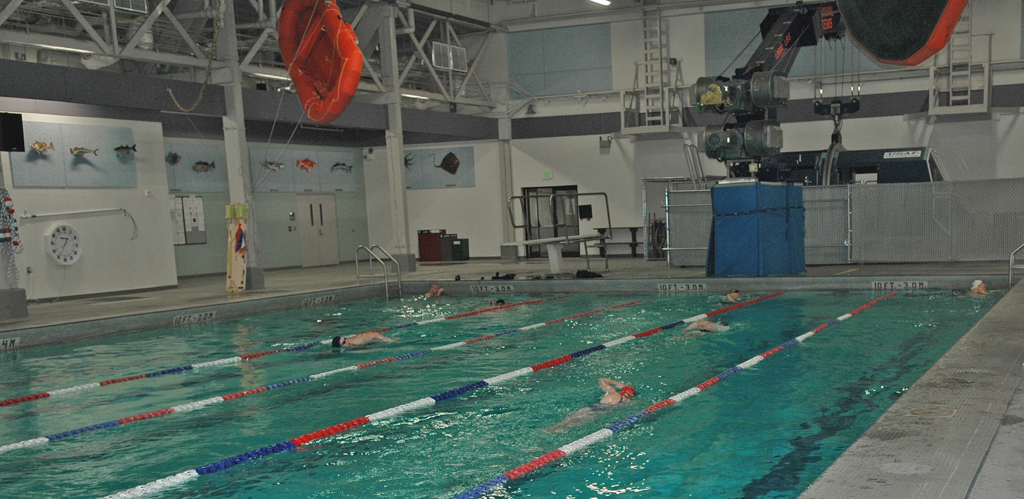 FAIRCHILD AIR FORCE BASE, Wash. -- Members of the Masters Swim Team swim laps at the base pool during practice Dec. 5. The swim team is open to any level of swimmer interested in joining who is over the age of 18. The team currently consists of beginning swimmers, individuals rehabilitating from injuries, and competitive swimmers. People interested in joining the Masters Swim Team should contact Mrs. McCoy at 247-2991. (U.S. Air Force photo/Tech. Sgt. Larry W. Carpenter Jr.)