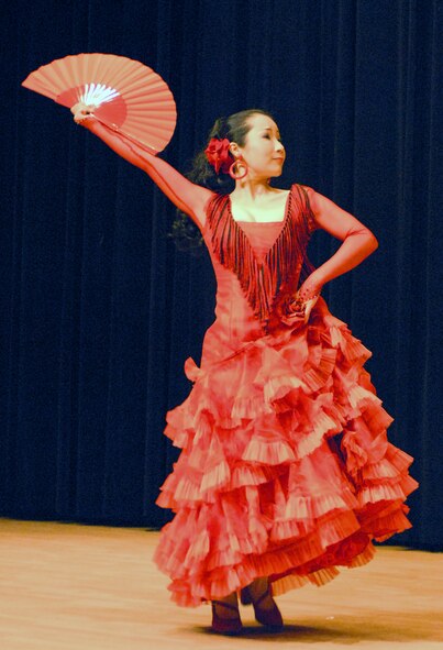 OSAN AIR BASE, Republic of Korea --  Song, Yeun Hee performs the Caracoles, a Spanish dance, during the Pyeongtaek University Concert at the Osan American High School on Dec. 5. This is the third year that professors and students from the university's music department have entertained Team Osan. (U.S. Air Force photo by Senior Master Sgt. Marvin Krause)