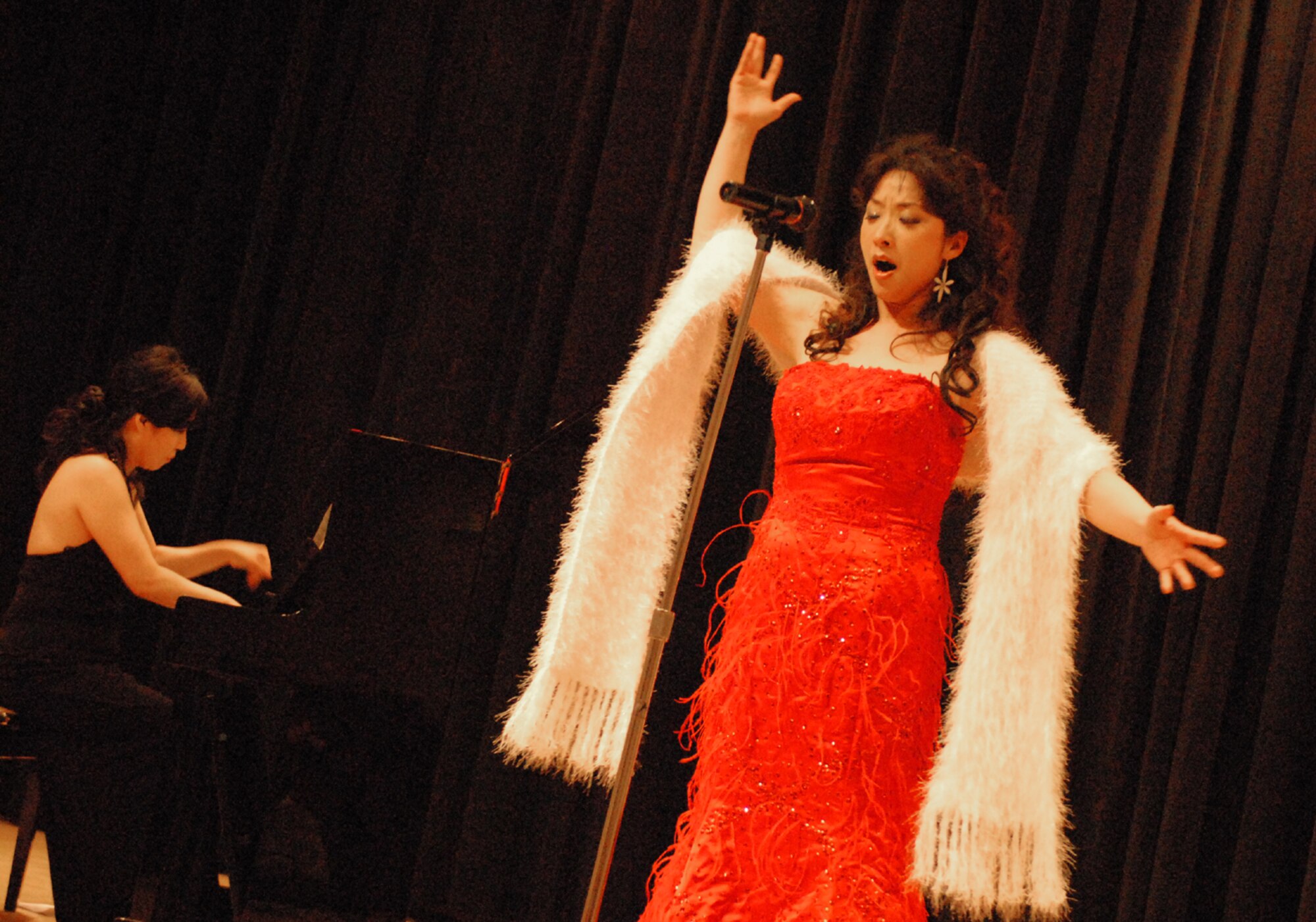 OSAN AIR BASE, Republic of Korea --  Kang, Myung Sook sings "La vie en Rose" during the Pyeongtaek University Concert at the Osan American High School on Dec. 5. This is the third year that students and professors from the university's music department have entertained Team Osan. (U.S. Air Force photo by Senior Master Sgt. Marvin Krause)