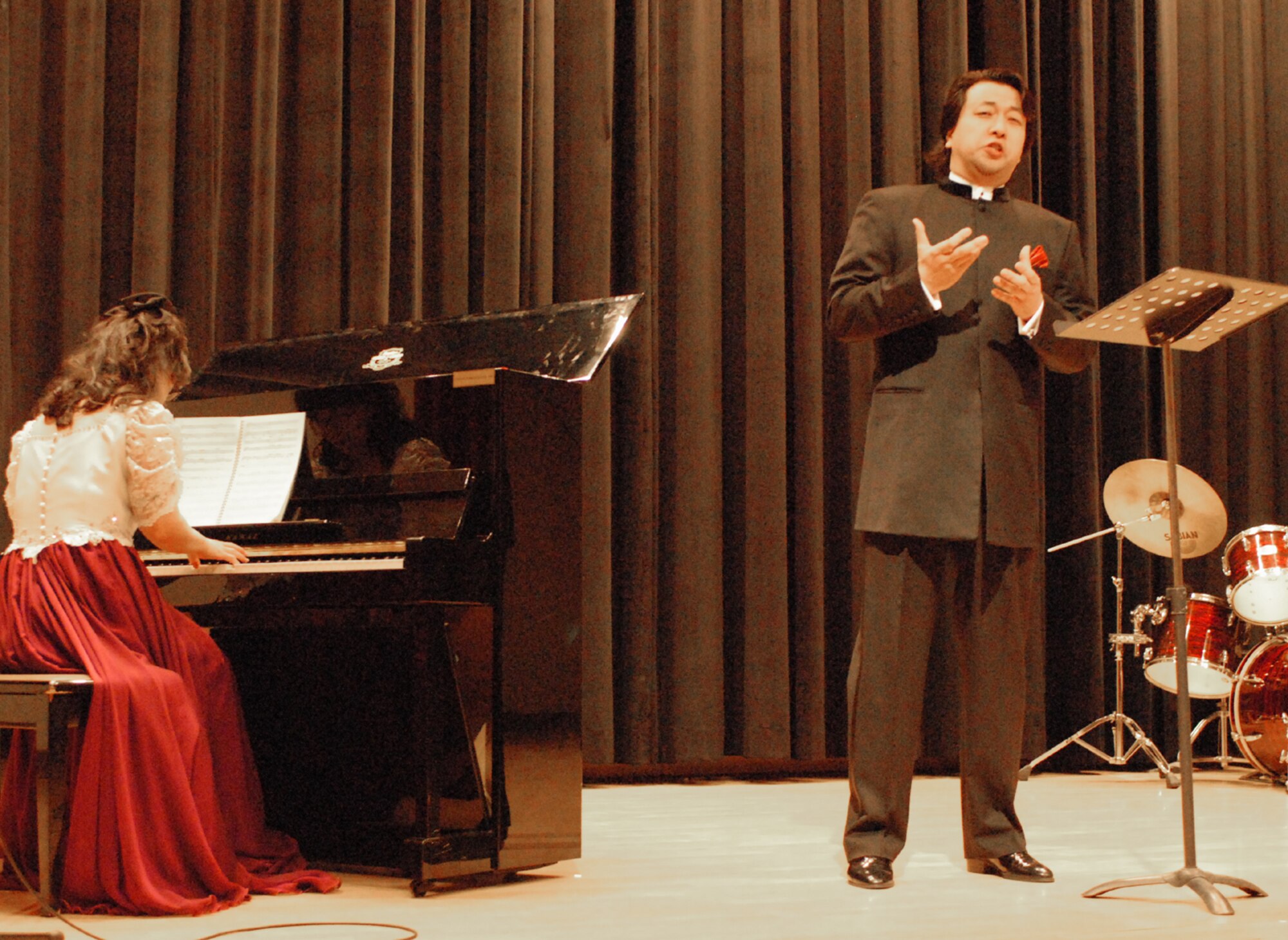 OSAN AIR BASE, Republic of Korea --  Kim, Hyung Ki sings "Nella Fantasia" during the Pyeontaek University Concert at the Osan American High School on Dec. 5. This is the third year professors and students from the university's music department have entertained team Osan. (U.S. Air Force photo by Senior Master Sgt. Marvin Krause)
