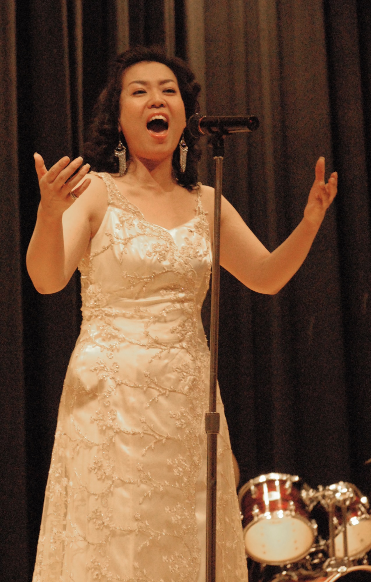 OSAN AIR BASE, Republic of Korea --  Ko, Hyae Wook sings "Once Upon a Dream" from Broadway's "Jekyll and Hyde - The Musical" at the Pyeongtaek University Concert at the Osan American High School on Dec. 5. This is the third year professors and students from the university's music department have entertained Team Osan. (U.S. Air Force photo by Senior Master Sgt. Marvin Krause)