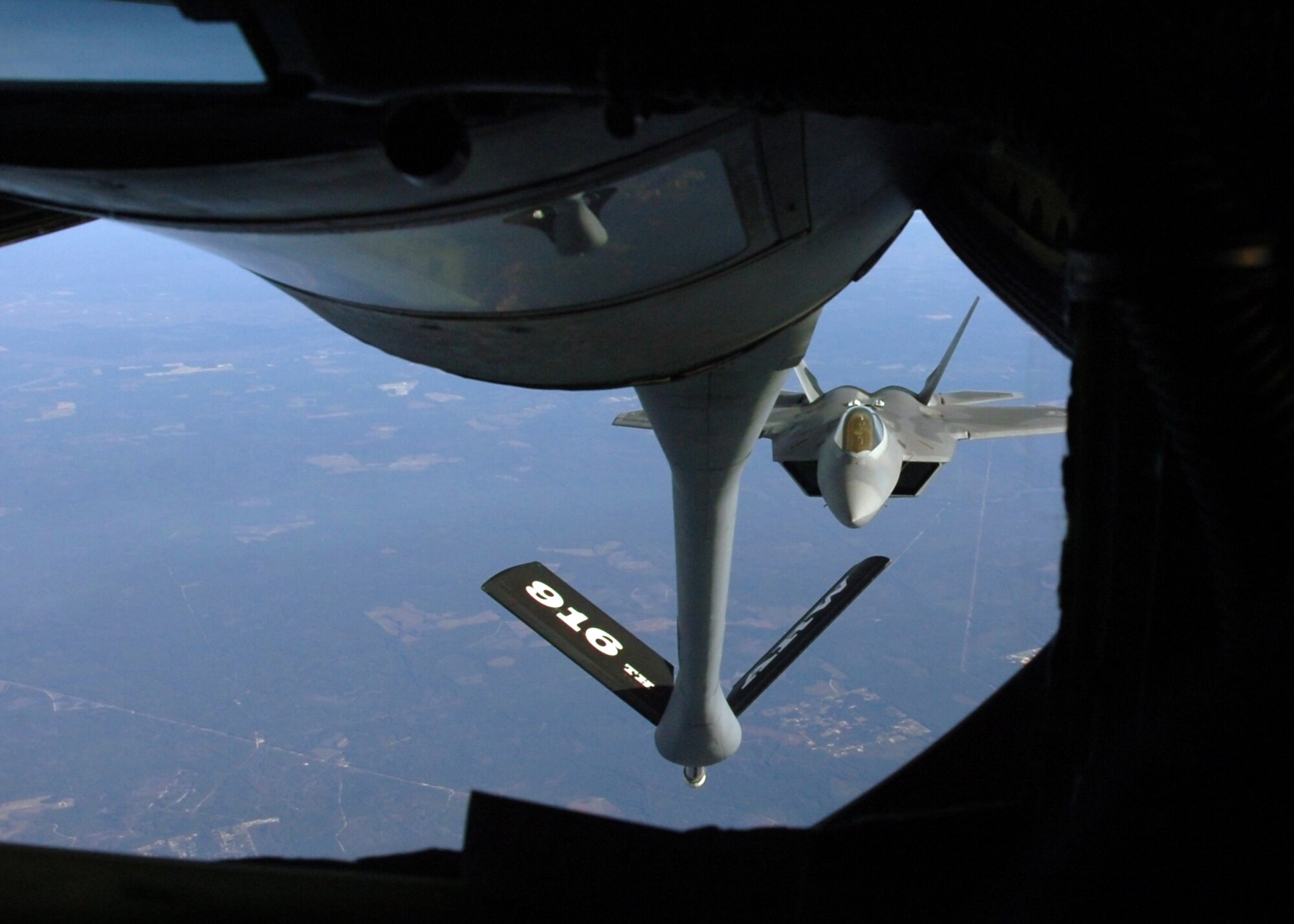 F-22 Raptor pilots from the 43rd Fighter Squadron, Tyndall AFB, Fla. conduct an air-to-air refueling training mission over Eglin AFB Dec. 4. The 916th Air Refueling Wing, which is an Air Force Reserve Wing located at Seymour Johnson AFB, N.C., provided KC-135R Stratotanker support during the mission. Tanker and fighter units from across the country travel to the Florida Panhandle to support the Raptor training mission based at Tyndall AFB. (U.S. Air Force photo/Staff Sgt. Bryan Franks)