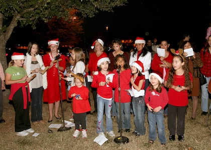 Members of the Chapel Children's Choir at Lackland Air Force Base, Texas, provide musical entertainment at the annual Christmas Tree Lighting on Nov. 29. (USAF photo by Robbin Cresswell)