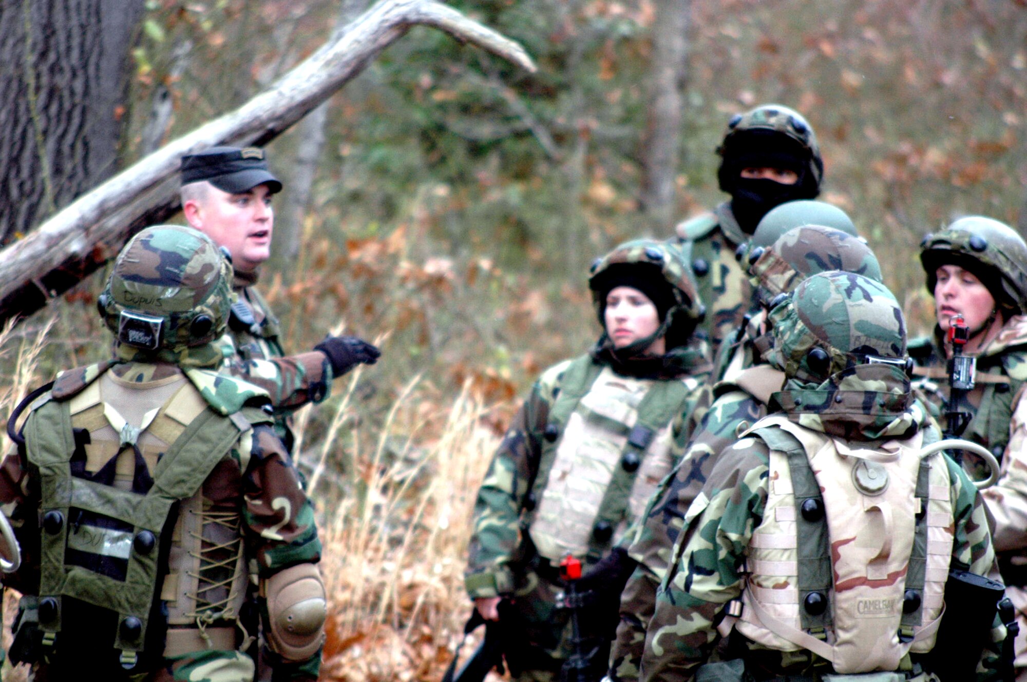 Tech. Sgt. Greg Hasecuster, contingency skills training instructor from the U.S. Air Force Expeditionary Center's 421st Combat Training Squadron, instructs students in the Air Force Advanced Contingency Skills Training Course 08-2 on combat tactics and patrolling during field training Dec. 4 on a range on Fort Dix, N.J.  The course is taught by the Center's 421st CTS and prepares Airmen for upcoming deployments.  (U.S. Air Force Photo/Tech. Sgt. Scott T. Sturkol) 