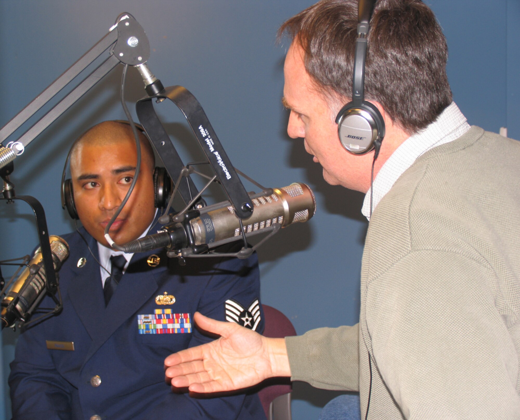 HANSCOM AFB, Mass. – Staff Sgt. Patrick Raass listens as Michael Graham, FM radio station 96.9 talk show host, asks him about his recent deployment Dec. 4. Mr. Graham hosted Hanscom’s Heroes’ Homecoming the next day. While praising the high level of patriotism on the part of local area residents, Sergeant Raass said he feels like a “superhero” when a child acknowledges him because of his military status. (U.S. Air Force photo by 1st Lt. Lisa Spilinek)