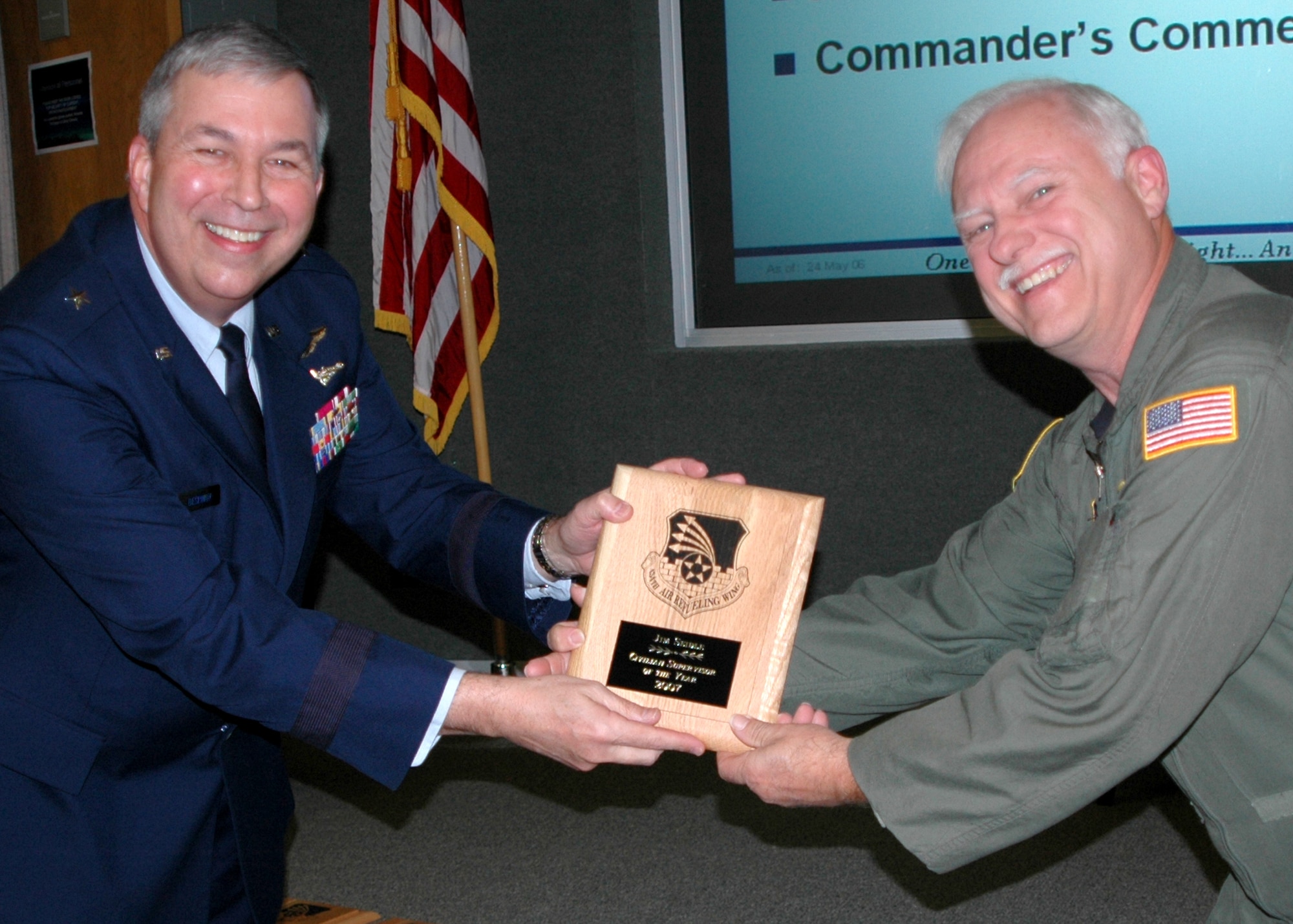 GRISSOM AIR RESERVE BASE, Ind., -- Brig. Gen. Dean Despinoy, 434th Air Refueling Wing commander, left, presents a plaque to Senior Master Sgt. James Seidle, a boom operator with the 72nd Air Refueling Squadron, on his selection as Grissom's Supervisor of the Year. The presentation was made during a recent civilian commander's call. (U.S. Air Force photo/Tech. Sgt. Douglas Hays)
