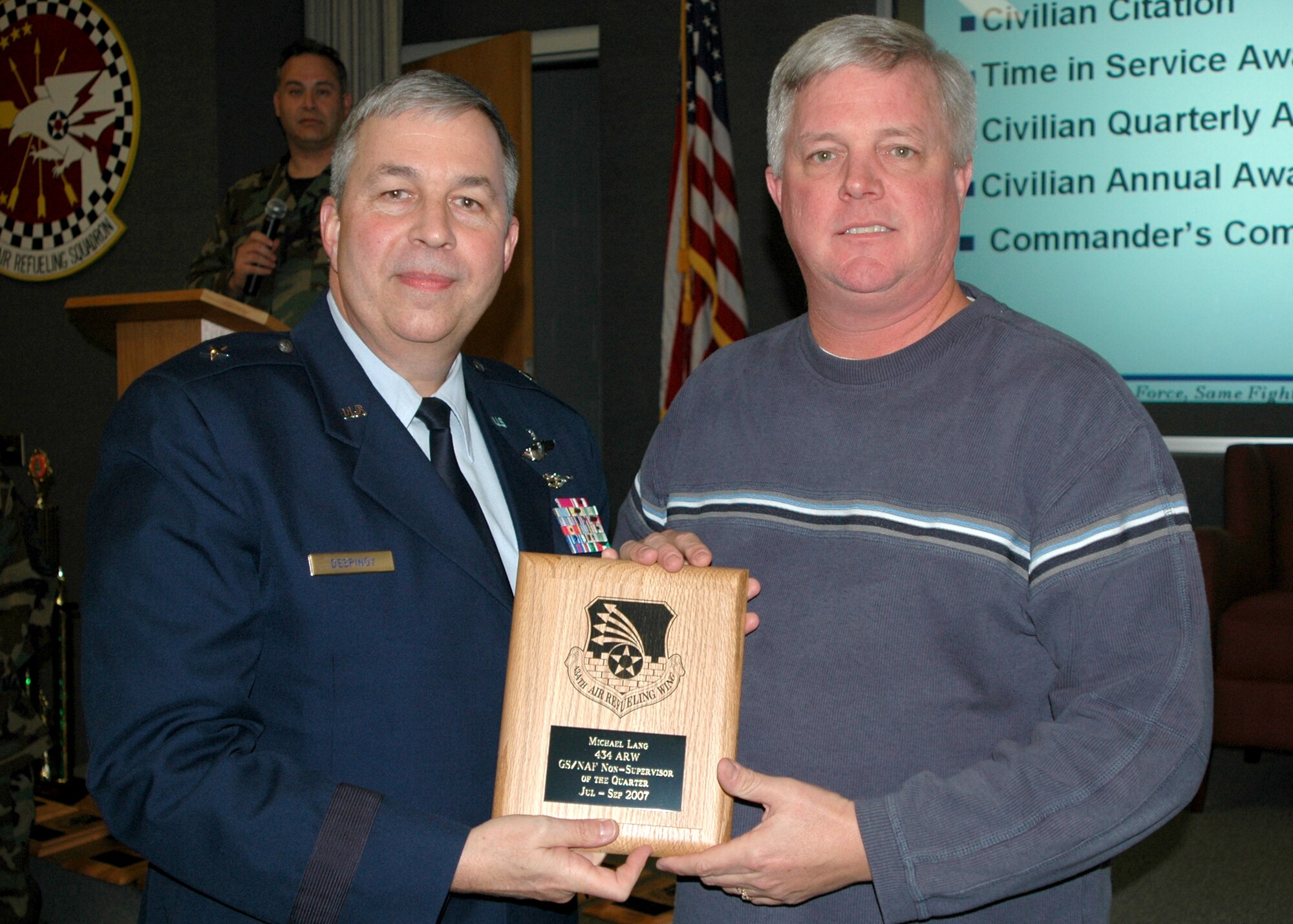 GRISSOM AIR RESERVE BASE, Ind., -- Brig. Gen. Dean Despinoy, 434th Air Refueling Wing commander, left, presents a plaque to Michael Lang, an air traffic controller, in recognition of his selection as the GS/NAF Non-Supervisor of the Quarter. (U.S. Air Force photo/Tech. Sgt. Douglas Hays)