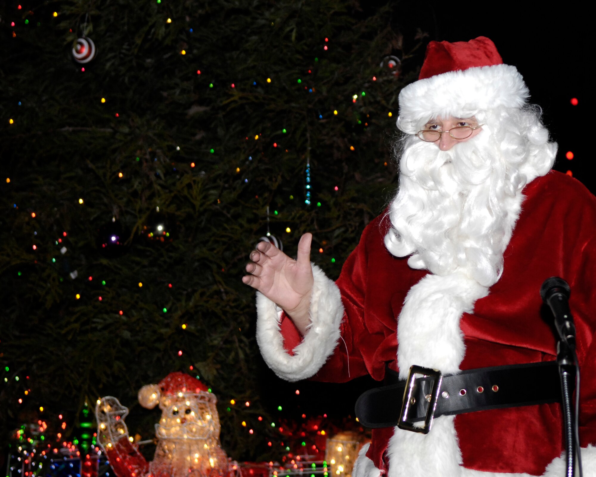 VANDENBERG AIR FORCE BASE, Calif. -- Santa Claus speaks at the Holiday Tree Lighting Ceremony in front of Building 11777 on Dec. 4.  The Tree Lighting Ceremony is held to honor the holiday season.  (U.S. Air Force photo/Airman 1st Class Jonathan Olds)