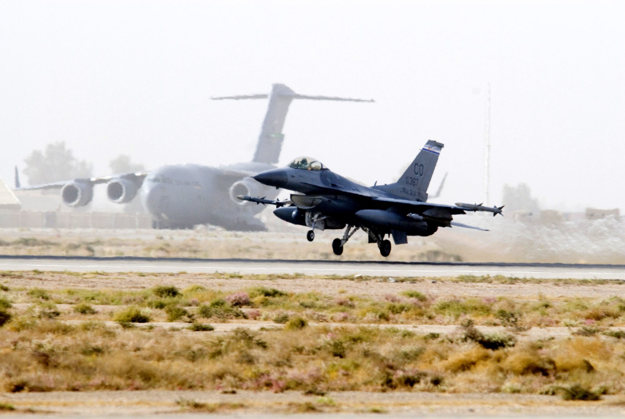 An F-16 Fighting Falcon from the Colorado Air National Guard takes off from Balad Air Base, Iraq.  F-16s fly various missions such as armed overwatch, shows of force and close air support while supporting Operation Iraq Freedom.  (U.S. Air Force photo by Master Sgt. John Nimmo, Sr.) 