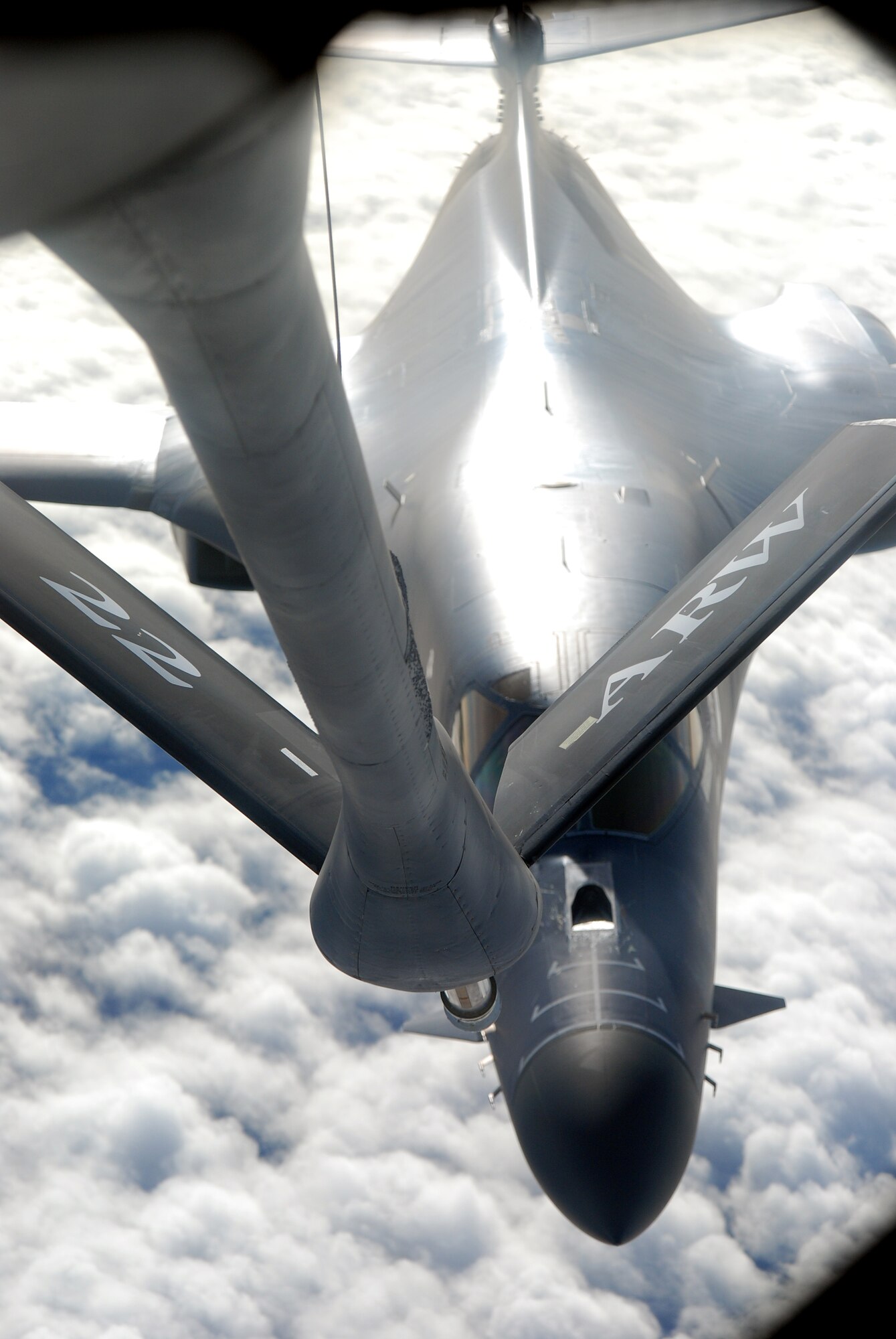 MCCONNELL AIR FORCE BASE, Kan. – A McConnell KC-135R Stratotanker’s boom docks with a B1 Bomber at 21,000 feet Dec. 5.  Along for the ride were 8 Airman from McConnell for a wing incentive flight.  Incentive flights are given out to Airmen who distinguish themselves in their on-the-job duties.  (Photo by Staff Sgt. Ronald Lafosse II)