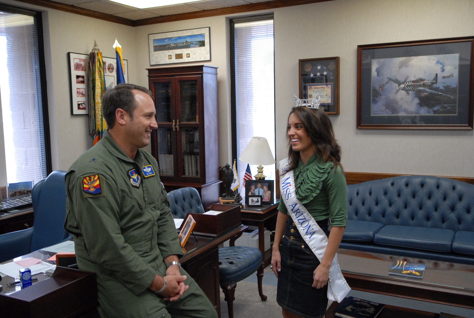 Brig. Gen. Tom Jones, 56th Fighter Wing commander, visits with Miss Arizona Nicole Turner in his office. Miss Turner visited the base and spoke with Airmen from the 56th Component Maintenance Squadron during their commander’s calls Nov. 29.  (photo by Airman 1st Class C.J. Hatch)