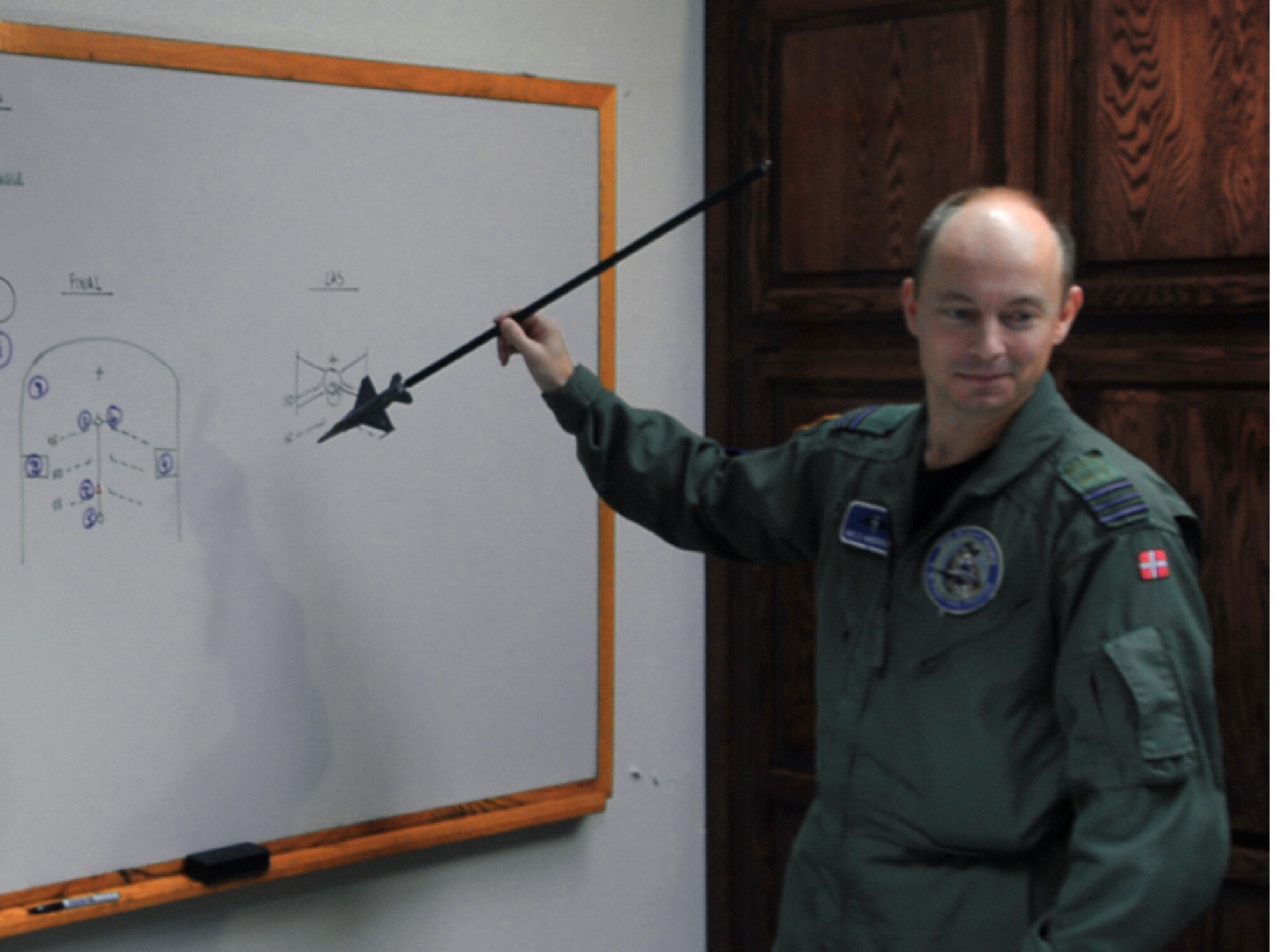 Capt. Niels Andersen, Royal Danish Air Force, instructs students in the 62nd Fighter Squadron. (photo by Airman 1st Class C.J. Hatch)