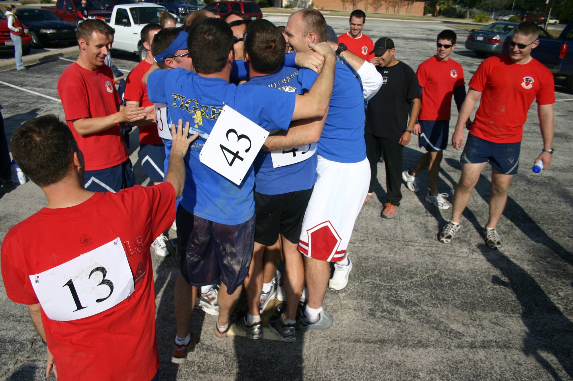 LAUGHLIN AIR FORCE BASE, Texas – A team from the 47th Operations Group works together to race to the finish line in the 9 legged challenge during Wingman Day Sept. 29. Wingman day consisted of several events to encourage teamwork and provide information on emotional, social, spiritual and physical health. (U.S. Air Force photo by Airman Sara Csurilla)