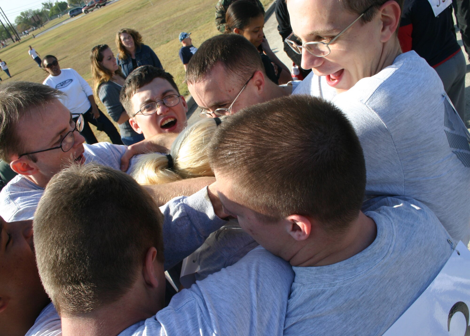 LAUGHLIN AIR FORCE BASE, Texas – A team from the 47th Operations Support Squadron works together on a team building challenge during Wingman Day Sept. 29. Wingman day consisted of several events to encourage teamwork and provide information on emotional, social, spiritual and physical health. (U.S. Air Force photo by Airman Sara Csurilla)
