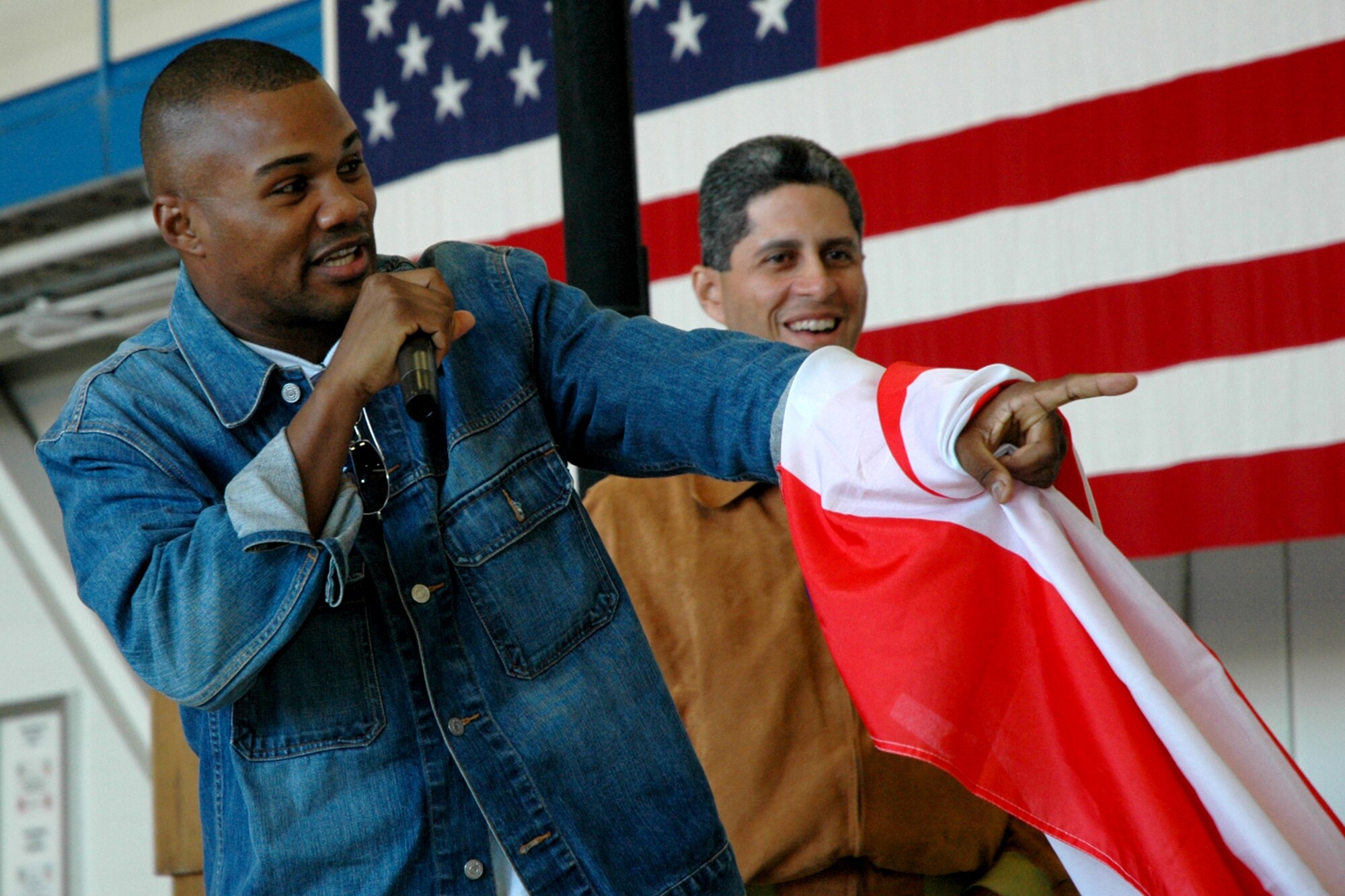 EGLIN AIR FORCE BASE, Fla. -- Felix "Tito" Trinidad points to Roy Jones Jr. while doing some smack talking in front of a crowd of Airmen Dec. 4 at a 33rd Fighter Wing hangar. Don King, Roy Jones Jr. and Trinidad made a visit to Eglin Airmen to sign autographs. Jones and Trinidad, with a combined 13 world titles, will meet in a much anticipated fight Jan. 19 at Madison Square Garden in New York City. (U.S. Air Force photo by Staff Sgt. Mike Meares)