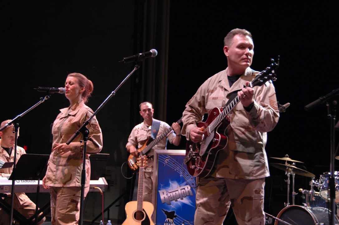 Raptor, the rock/popular music group of the USAF Heartland of America Band, performed during the 'Heritage to Horizons Hanger Bash 07'  on Oct. 6, 2007 celebrating the 60th Anniversary of the Air Force. Their performance showcased dance music from 1980's era through today.
