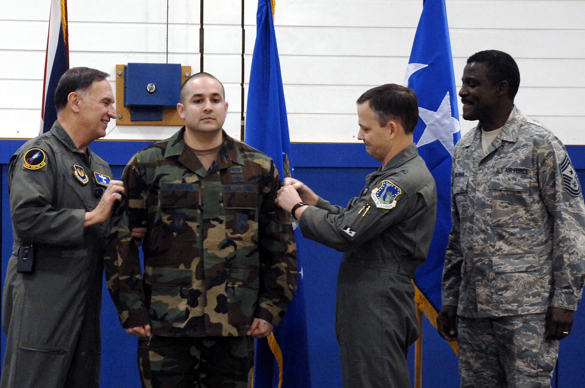 Staff Sgt. Anthony Meadows,  48th Communications Squadron, is STEP promoted to technical sergeant by William T. Hobbins, U.S. Air Forces in Europe commander, and Brig. Gen. John Hesterman, 48th Fighter Wing commander, during an Airmen’s call Dec. 3 at RAF Lakenheath, England. (U.S. Air Force photo by Airman 1st Class Erika Brooke)