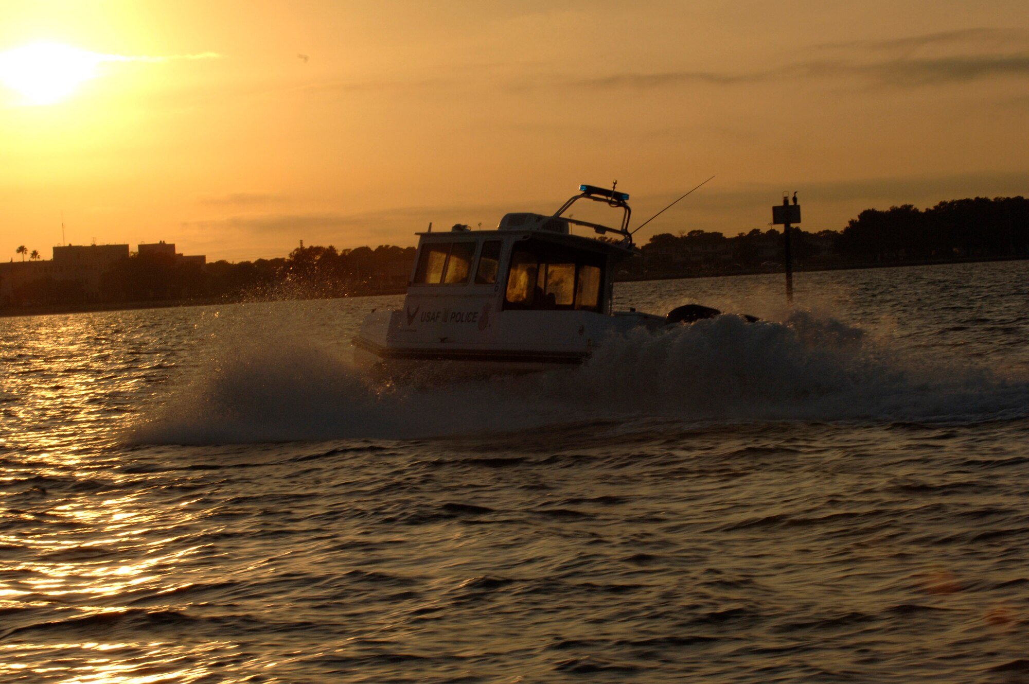 Members of the 6th Security Forces Squadron boat patrol at MacDill Air Force Base, Fla., police Tampa Bay Nov. 27.  The 6th SFS is one of the few security forces squadrons in the Air Force to have a boat patrol and the only one to patrol overnight. (U.S. Air Force photo/Airman Rylan Albright)