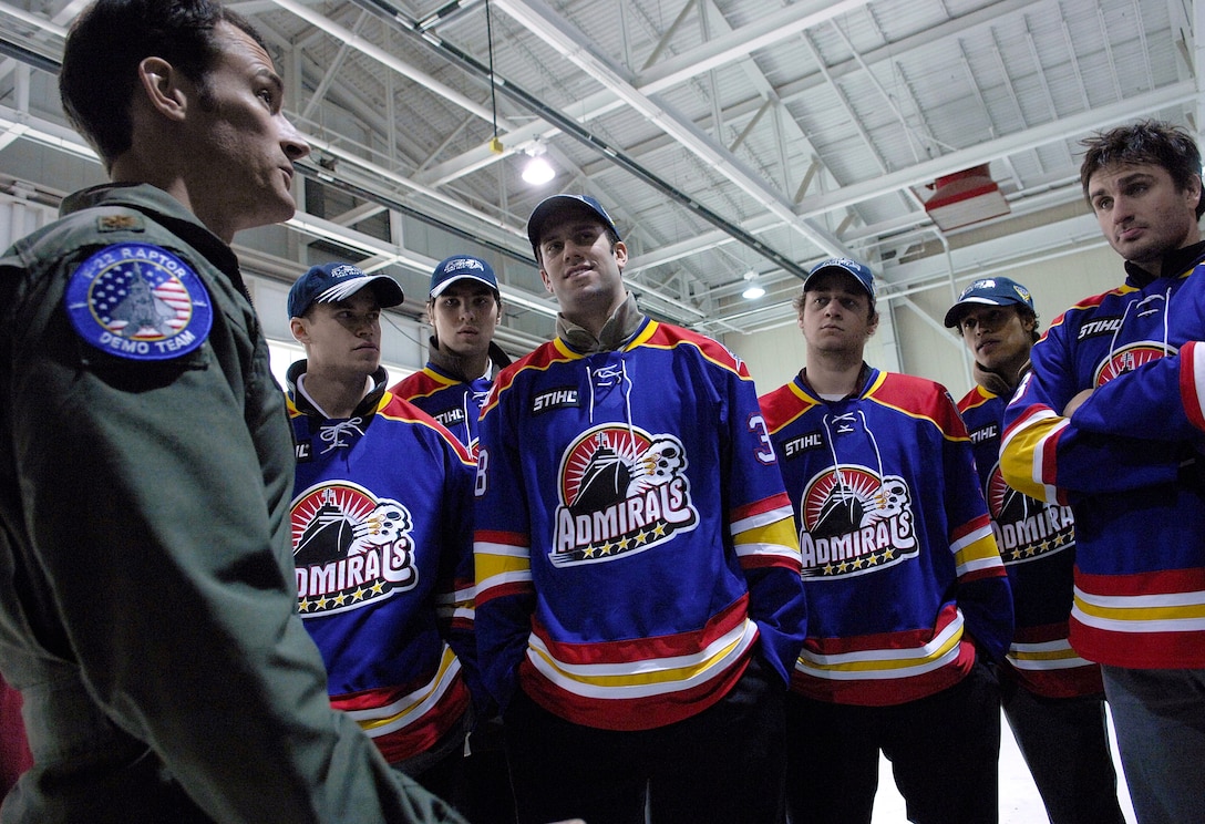LANGLEY AIR FORCE BASE, Va.--Maj. Paul "Max" Moga, F-22 Demo Team pilot, explains the Air Force's only fifth-generation jet to the Norfolk Admirals hockey team here Dec. 4. The Admirals are the top developmental affiliate of the National Hockey League’s Tampa Bay Lightning. (U.S. Air Force photo/Staff Sgt. Samuel Rogers)