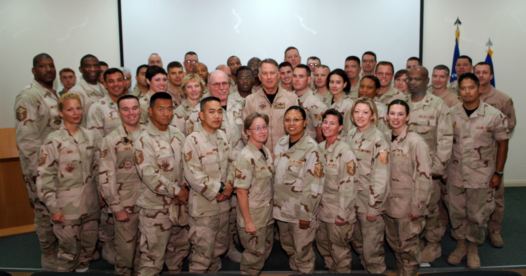 SOUTHWEST ASIA -  Lt. Gen. John Brady (center), Air Force Reserve Center commander, is surrounded by Air Force Reserve members on a recent tour of facilities at the 379th Air Expeditionary Wing at a Southwest Asia air base. 
(U.S. Air Force Photo/Master Sgt. Greg Kunkle)